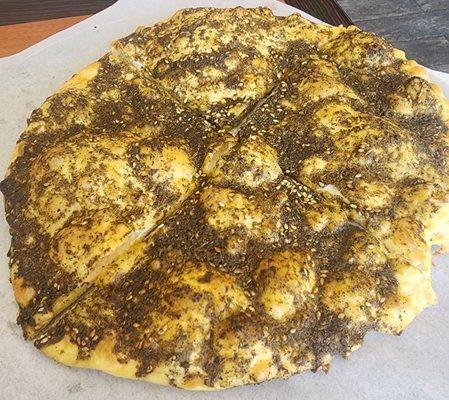 Arab Zaater which is it combination of oragano, thyme, sesame seed, and olive oil all mixed together and baked.