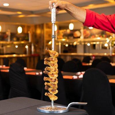 12 different types of meat which are presented on skewers and carved table side. www.cafemineirosteakhouse.com