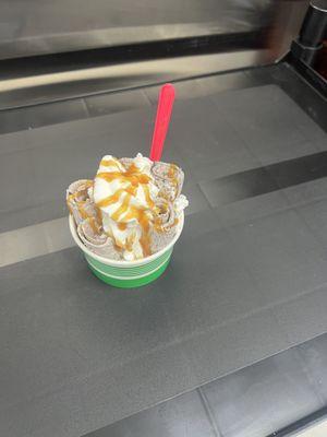 This was a create your own rolled ice cream with Oreos, topped with whipped cream and caramel