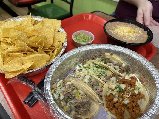 Family Size Refried Beans, large chips, street tacos (2 carnitas, 2 carne asada, and adobada), small guacamole.