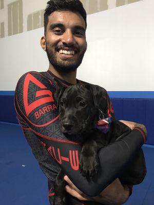 Coach Bilal posing with Cisco after No-Gi training.