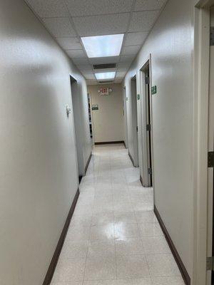 Interior hallway with patient lab rooms along the hall