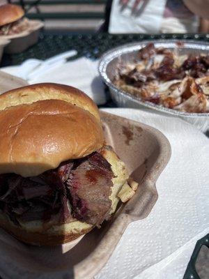 Brisket Sandwich and Brisket Nachos in the background.