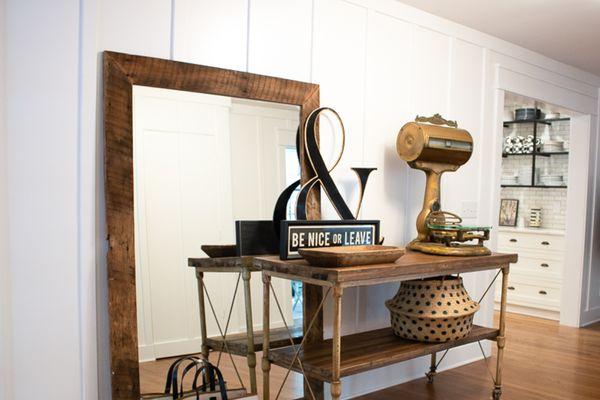 Oversized wood floor mirror.