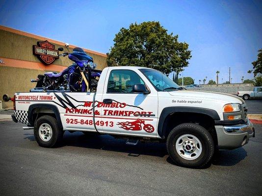 Professional, safe and secure motorcycle towing with custom built equipment