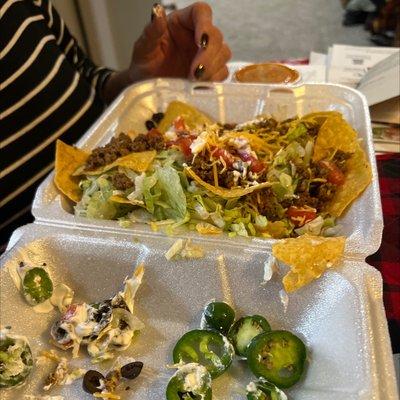 This is supposed to be a taco salad.  It looks like and is cold soggy nachos with a little lettuce thrown at them.  Not acceptable.