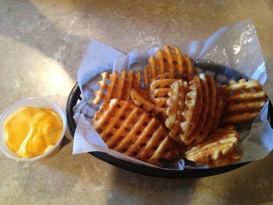 Waffle fries and cheese ordered early as a side instead of as a starter.