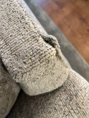 Metal sticking out of sofa and chair and a half. Through fabric.