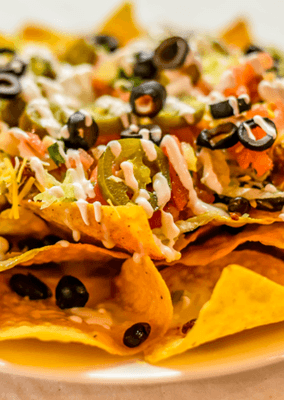 Crunch into nacho heaven with our loaded Nachos! Melted cheese, savory toppings, and crispy chips - the ultimate delight. #NachoFiesta