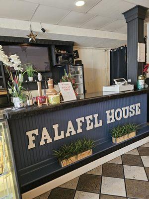 The main counter where takeout orders are picked up.