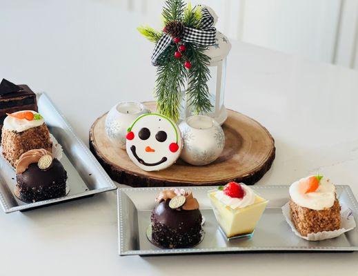 Rum cake, chocolate cake, carrot cake, tiramisu, snowman cookie.