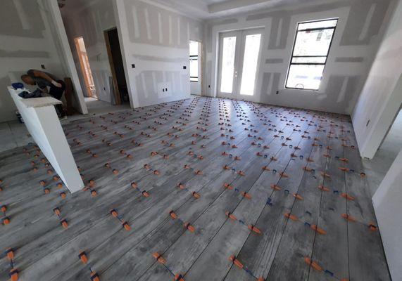 Laying laminate on the floor, preparing the walls