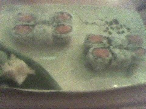 Spicy tuna roll on left spicy salmon crunch roll on right