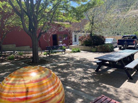 A few outdoor picnic tables and benches.