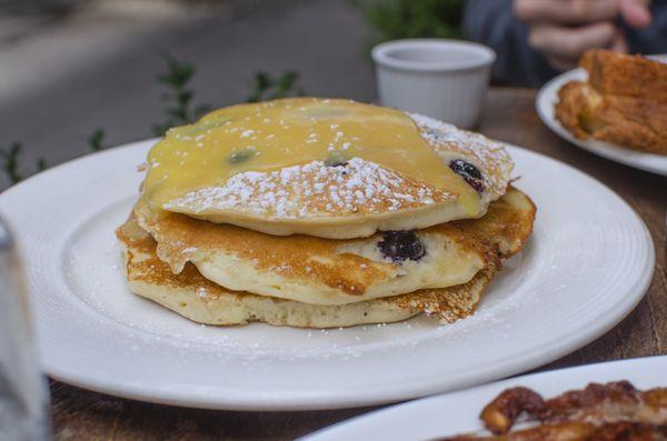 Blueberry buttermilk ricotta pancakes w/ lemon curd