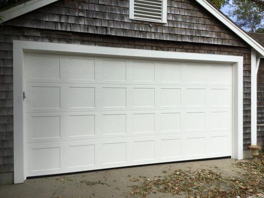 Haas double wide steel garage door with short recessed panels in Osterville