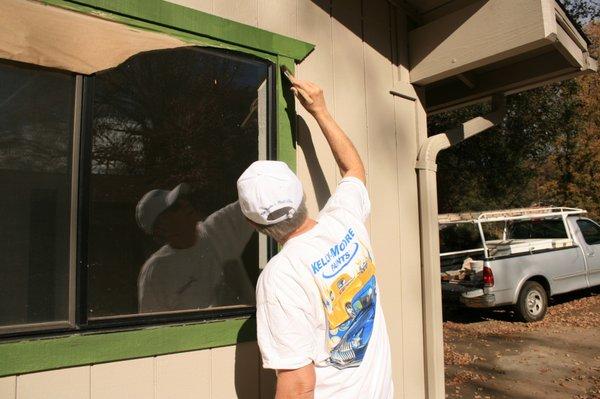 American Painting painted siding and now Trimming windows.