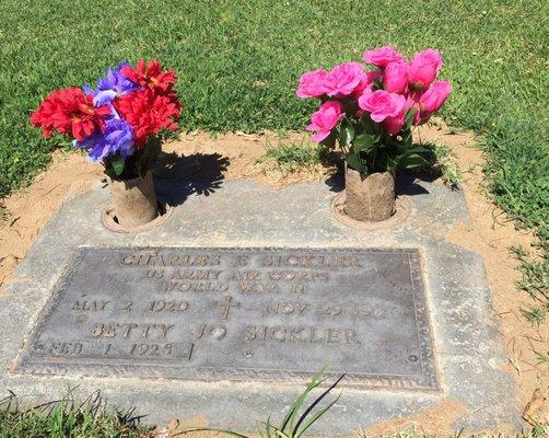 Did you know there are built in vases at every grave site? Just turn that circle thing over and it's ready for flowers.