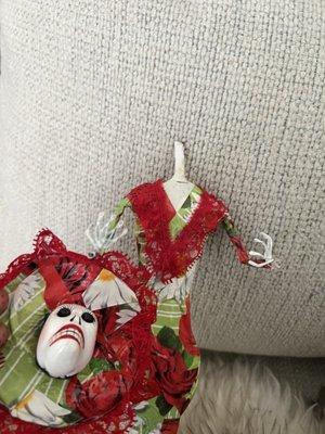 Doll with spider webs was wrapped up once I opened in the head was broken off