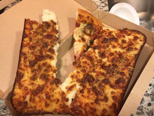 Does this look like extra cheese pizza that is hot or fresh?