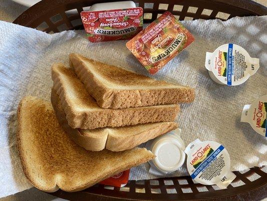 Stale white bread (they were out of rye) for toast with strawberry jam.