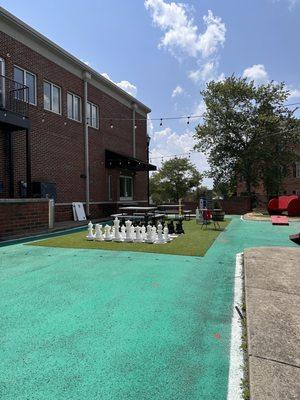 Outdoor area with chess, Jenga, corn hole and Connect 4.