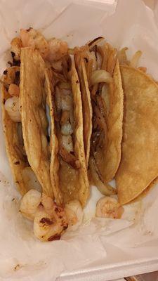 Shrimp tacos with missing raw onion and cilantro.....they put a tiny amount of cooked onion..empty shells...horrible