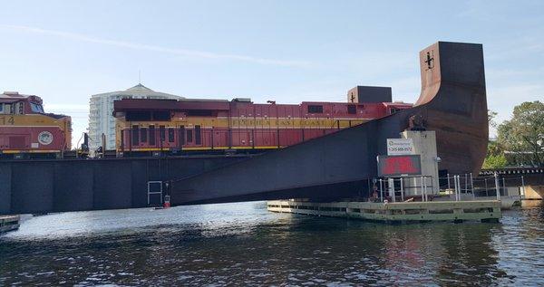 Train Crossing bridge as seen from the water