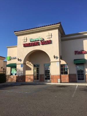 Store front in between H&R Block and Flame Broiler