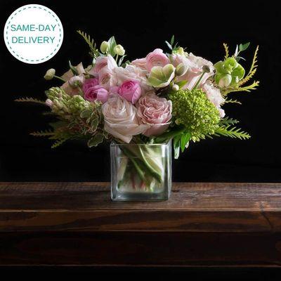 Soft and delicate, Blush Sweet is designed with gorgeous pink ranunculus, fragrant hyacinthus, pink roses and mini green hydrangeas