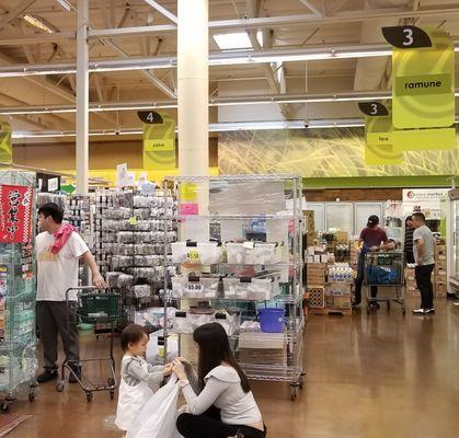 Go inside Seiwa Grocery, between aisles 3 + 4; look for the sake sign (no sake) and racks that look wrapped in plastic, that's the store!!