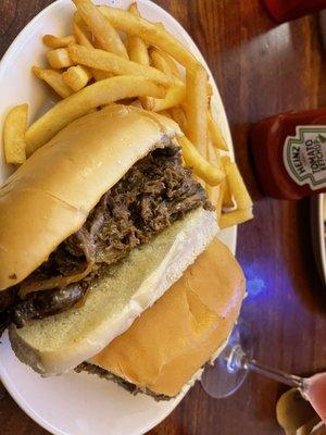 Philly steak sandwich with fries