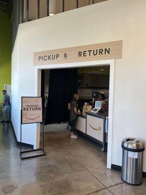 Amazon return area and Whole Foods. Located in the front of store.