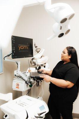 Carol is having a blast with the YOMI robot--fun times all around!