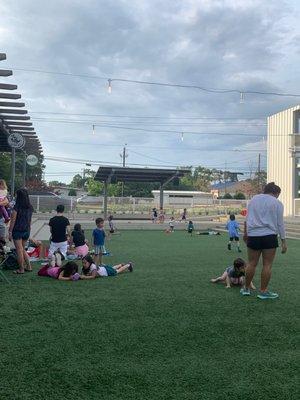 Grassy area for the kids to run. Bring a ball and some bubbles!