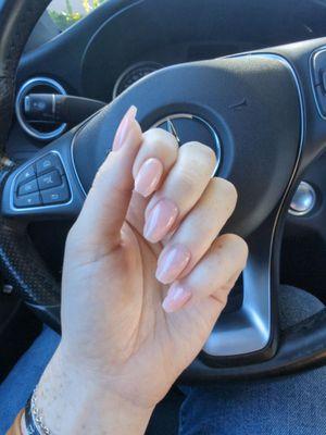 Nude pink square nails with a touch of sparkle