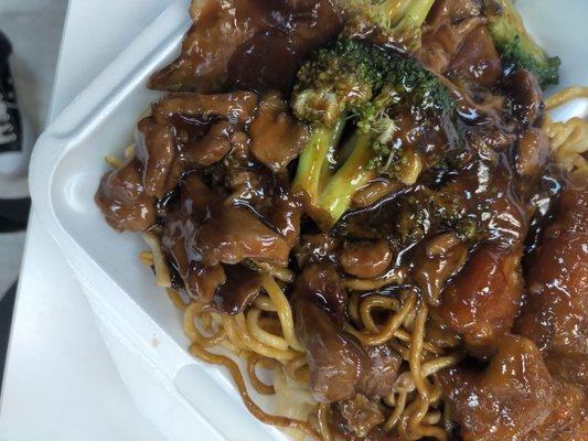 Beef and meat, and teriyaki chicken atop lo mein noodles