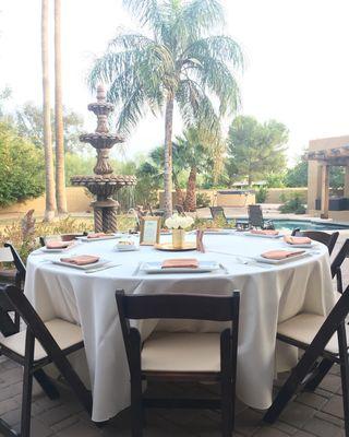 Fruitwood chairs, 72" table and ivory table linen from White Knight Party Rentals.