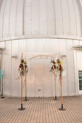 Beautiful chuppah rented from Afikomen decorated with flowers by our florist