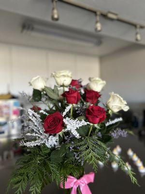 Red & white roses with snow capped pieces