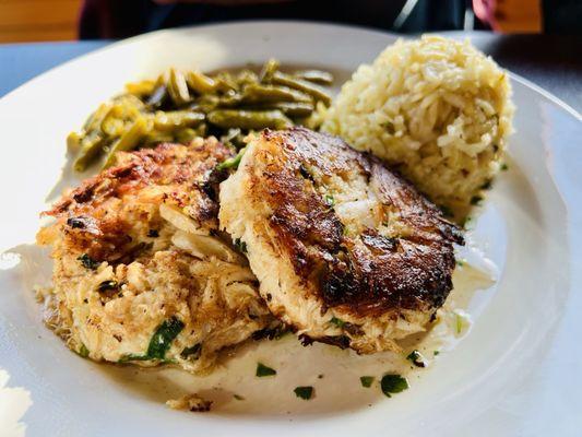 Crab cakes with green beans and rice pilaf.