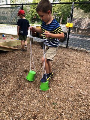 Using bucket stilts.