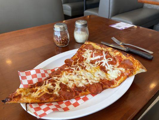 Giant slice of Pepperoni Pizza