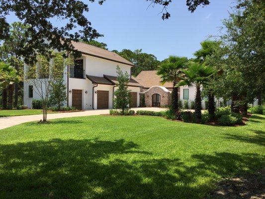 New construction. Brick paver driveway, full landscaping installation. Palm trees, shrubs, Irrigation, sod & pine straw installation.