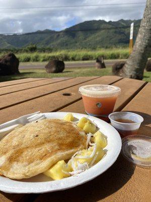 Griddled pancakes and small pineapple guava juice.