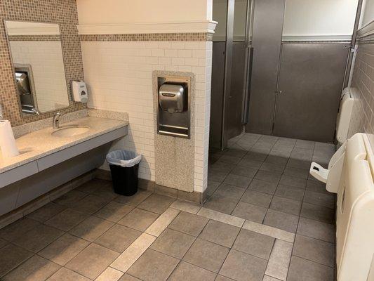 Clean men's room with changing stations