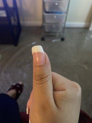 My crooked nail on my thumb because she filed it too much on one side