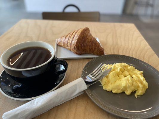 Croissant scrambled eggs and Americano