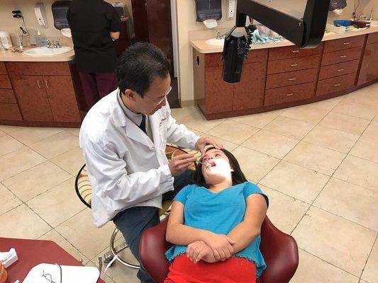 Examination by Dr. Banh after getting braces removed.