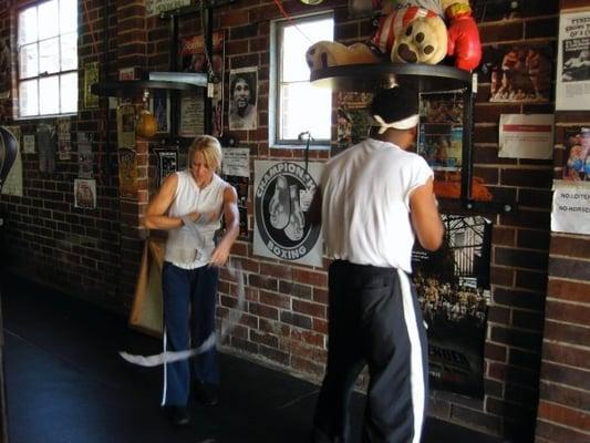 Terri "The Boss" Moss and Xavier "Bad Pads" Biggs warming up